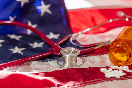 Conception of a stethoscope on an American Flag representing healthcare in the United States.の写真素材
