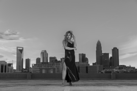 
A beautiful blonde model posing outdoors in an urban environmentの写真素材