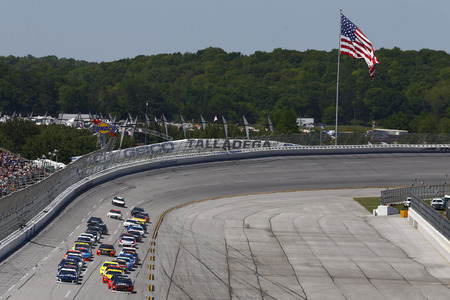 The Monster Energy NASCAR Cup Series teams race down the front stretch during the GEICO 500 at Talladega Superspeedway in Talladega, Alabama.のeditorial素材
