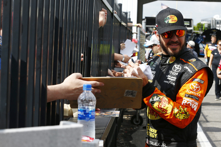 June 01, 2018 - Long Pond, Pennsylvania, USA: Martin Truex, Jr (78) signs autographs for fans before qualifying for the Pocono 400 at Pocono Raceway in Long Pond, Pennsylvania.のeditorial素材