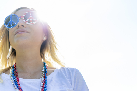 A patriotic blonde model having fun during the 4th of July holiday.  の写真素材