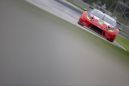 August 03, 2018 - Elkhart Lake, WI, USA:  The Paul Miller Racing TOTAL/ Universal Industrial Sales Lamborghini Huracan GT3 races through the turns at the Continental Tire Road Race Showcase at Road America in Elkhart Lake, WI.のeditorial素材