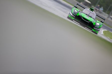 August 03, 2018 - Elkhart Lake, WI, USA:  The Tequila Patron Nissan DPI car races through the turns at the Continental Tire Road Race Showcase at Road America Elkhart Lake, WI.のeditorial素材