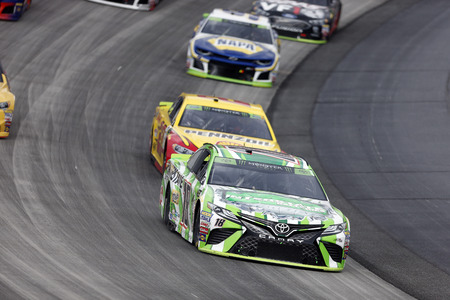 October 07, 2018 - Dover, Delaware, USA: Kyle Busch (18) races through the field off turn two at ...