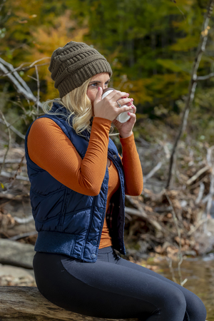 A beautiful blonde model posing outdoors in an forest environmentのeditorial素材