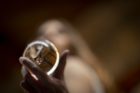A gorgeous Hispanic Brunette model poses indoors in home environmentの写真素材
