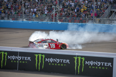 March 10, 2019 - Avondale, Arizona, USA: Kyle Busch (18) wins the Ticket Guardian 500 at ISM Raceway in Avondale, Arizona.のeditorial素材
