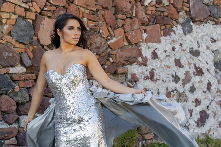 A gorgeous Hispanic Brunette model poses outdoors in home environmentの写真素材