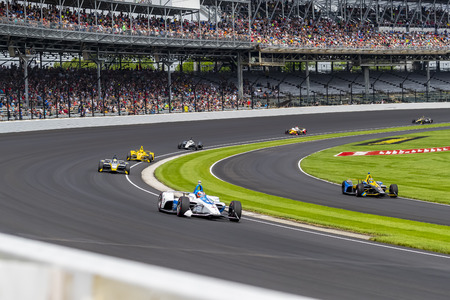 FELIX ROSENQVIST (R) (10) of Sweden prepares to practice for the Indianapolis 500 at Indianapolis...
