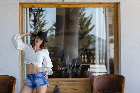 A gorgeous Hispanic Brunette model poses indoors in home environmentの写真素材