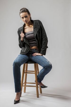 Gorgeous long haired brunette model posing against a white backgroundの写真素材