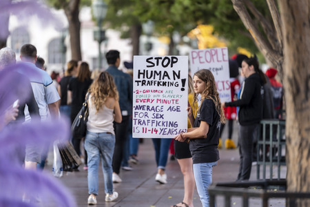 November 07, 2019 - Las Vegas, Nevada, USA: Young protestors show their support for stopping human trafficking in front of the Bellagio Hotel and Resort in Las Vegas, Nevada.のeditorial素材