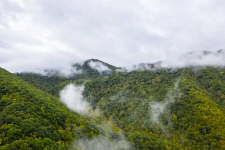 Mountain range during a rain storm in a rural environment