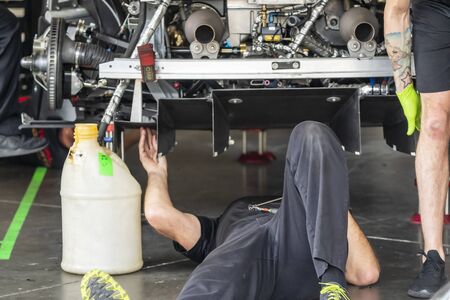 January 24, 2020 - Daytona Beach, Florida, USA: Crewmembers work on their cars before the Rolex 24 At Daytona at Daytona International Speedway in Daytona Beach, Florida.のeditorial素材