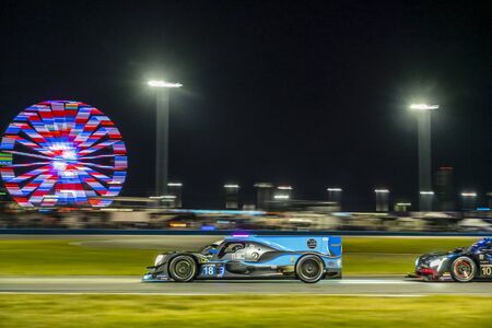 The ERA Motorsport Oreca LMP2 07 car  race through the night during the Rolex 24 At Daytona at Daytona International Speedway in Daytona Beach, Florida.のeditorial素材