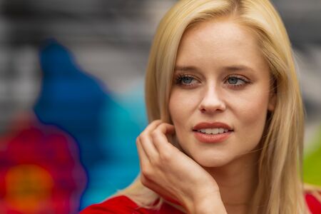 A gorgeous blonde model enjoys a spring day outdoorsの写真素材