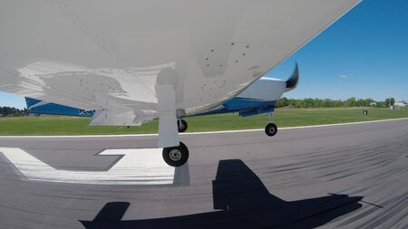 Views of a general aviation aircraft performing maneuvers on the ground and in the air