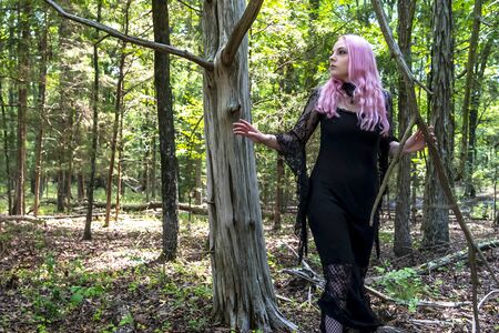 A gorgeous gothic model acts in a forest environmentの写真素材