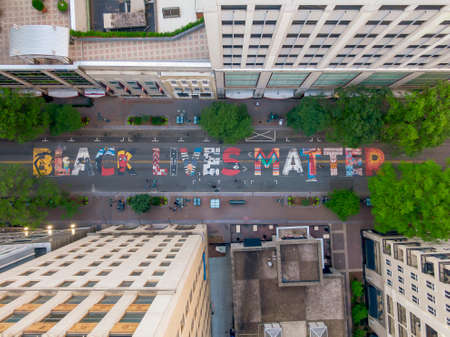 June 14, 2020 - Charlotte, North Carolina, USA: In protest to the ongoing racial riots, Black Lives Matter is painted on the ground on Tryon Street in Charlotte, NC.のeditorial素材