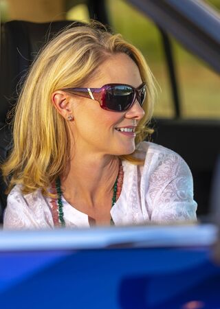 A gorgeous blonde model enjoys a spring day outdoors in the American Southwestの写真素材