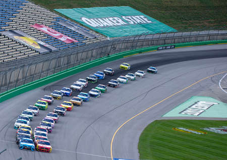 Martin Truex Jr. (19) races for the Quaker State 400 Presented by Walmart at Kentucky Speedway in Sparta, Kentucky.のeditorial素材