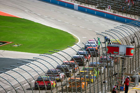 Drivers race for position the O'Reilly Auto Parts 500 at Texas Motor Speedway in Fort Worth, Texas.のeditorial素材