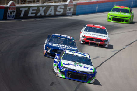 Ty Dillon (13) races for position for the O'Reilly Auto Parts 500 at Texas Motor Speedway in Fort Worth, Texas.のeditorial素材
