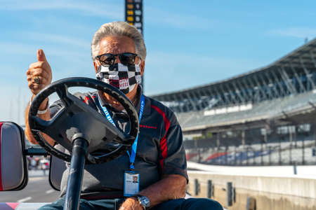 Legend, Mario Andretti, talks to drivers before Carb Day for the Indianapolis 500 in Indianapolis, Indiana.のeditorial素材