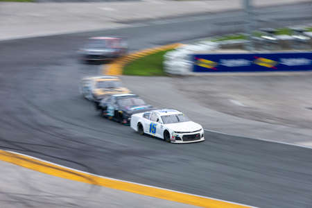 Brennan Poole (15) races for position for the Go Bowling 235 at the DAYTONA Road Course at Daytona International Speedway in Daytona Beach, Florida.のeditorial素材
