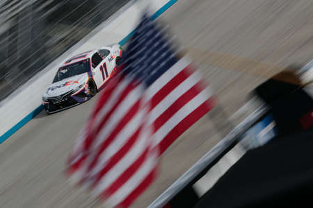 Denny Hamlin (11) races for the Drydene 311 at Dover International Speedway in Dover, Delaware.のeditorial素材