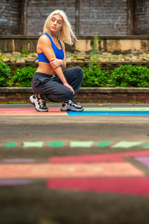A gorgeous young blonde model works out  outdoors while enjoying a summers dayの写真素材