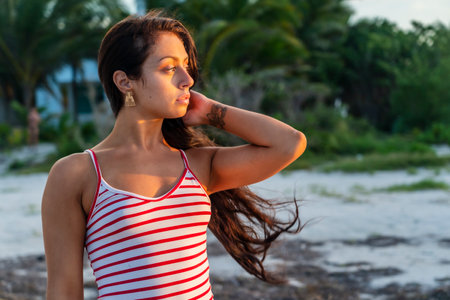 A beautiful brunette model enjoys the sunset in the YucatÃ¡n Peninsula near Merida, Mexicoの写真素材