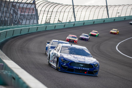 Brad Keselowski (2) races for position the Dixie Vodka 400 at Homestead Miami Speedway in Miami , Florida.のeditorial素材