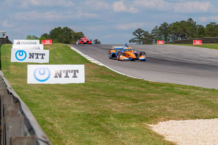 SCOTT DIXON (9) of Auckland, New Zealand races through the turns during the  race for the Honda Indy...