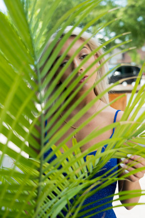 A gorgeous blonde model poses outdoors in an urban environmentの写真素材