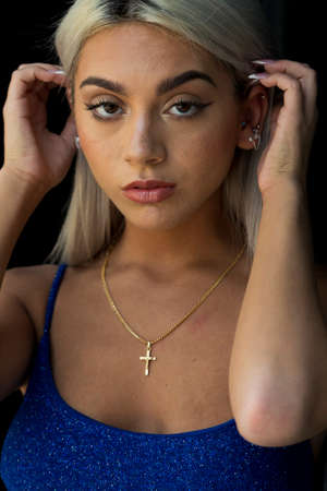 A gorgeous blonde model poses outdoors in an urban environmentの写真素材