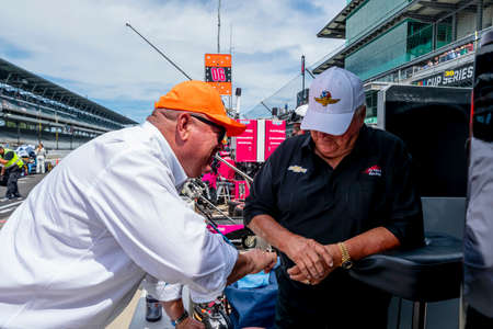 IndyCar Team Owners, AJ Foyt Jr and Chip Ganassi talk before the start of the Big Machine Spiked Coolers Grand Prix at Indianapolis Motor Speedway in Indianapolis, Indiana.のeditorial素材