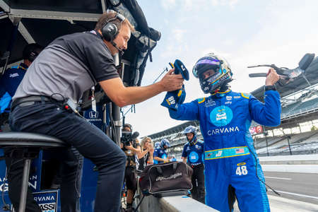 Former Crew Chief, Chad Knauss, watches his friend, JIMMIE JOHNSON (R) (48) of The United States as he prepares to qualify for the Big Machine Spiked Coolers Grand Prix at the Indianapolis Motor Speedway in Indianapolis, Indiana.のeditorial素材