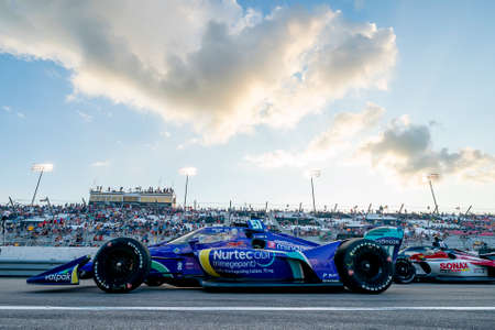 Crewmembers of \{persons}\ prepare their car to race for the Bommarito Automotive Group 500 at World...