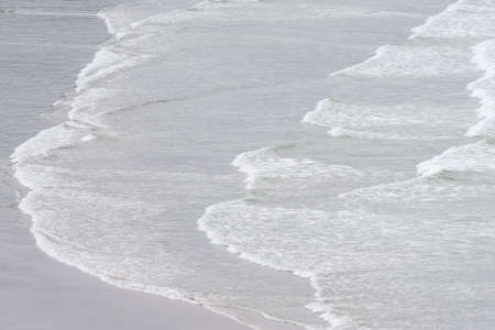 Morning fog sits on the shore of the Oregon Coastの写真素材