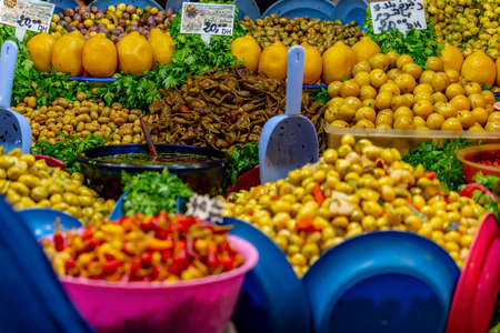 Small fruits, vegetables, and meats are sold in the open market in the blue city Medina of Fez, Morocco, Africa.のeditorial素材