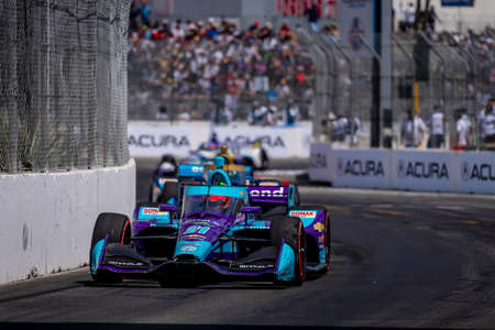 RINUS VEEKAY (R) (21) of Hoofddorp, Netherlands races through the turns during the Acura Grand Prix...