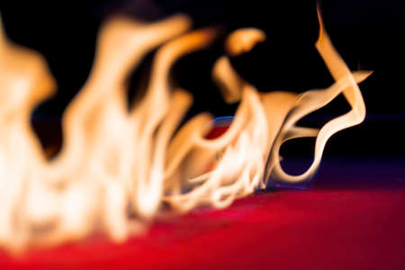 Billiard balls are photographed on fire while sitting outdoors in an open environmentの写真素材