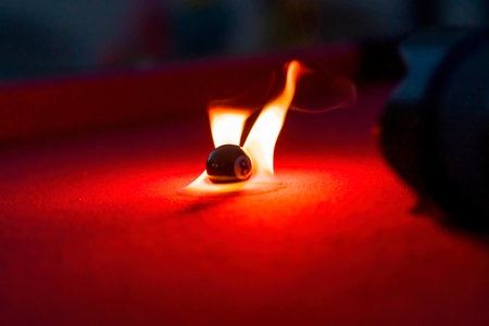Billiard balls are photographed on fire while sitting outdoors in an open environmentの写真素材