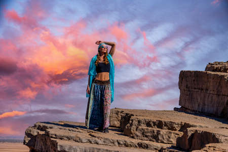 A gorgeous model poses outdoors in the mountains of Moroccoの写真素材