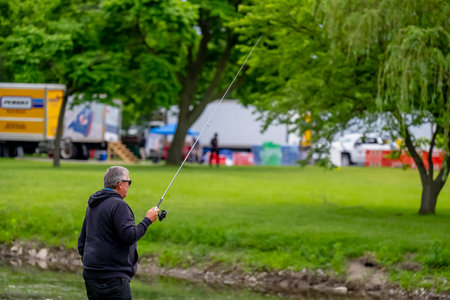 Fans take a break from the Chevrolet Detroit Grand Prix at the Belle Isle Park in Detroit, MI, USA.のeditorial素材