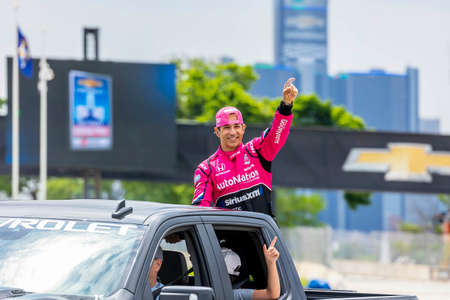 HELIO CASTRONEVES (06) of Sao Paulo, Brazil waves to the fans before racing for the Chevrolet...
