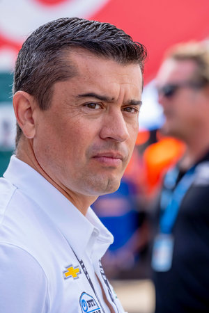 Team Owner, RICARDO JUNCOS, watches his team work on their Juncos Hollinger Chevrolet before a practice session for the Honda Indy Toronto at the Streets of Toronto Exhibition Place in Toronto, ON, CAN.のeditorial素材