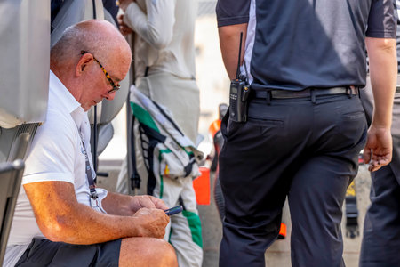 Team Owner, BRAD HOLLINGER, watches his team work on their Juncos Hollinger Chevrolet before a practice session for the Honda Indy Toronto at the Streets of Toronto Exhibition Place in Toronto, ON, CAN.のeditorial素材