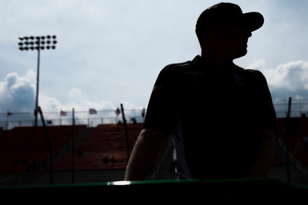 Crew members of Juncos Racing prepare their race car before a practice session for the Bommarito Automotive Group 500 in Madison, IL, USA.のeditorial素材